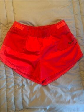 ( size on shorts size small) 
Nike Women's Bright Red Athletic Running Shorts